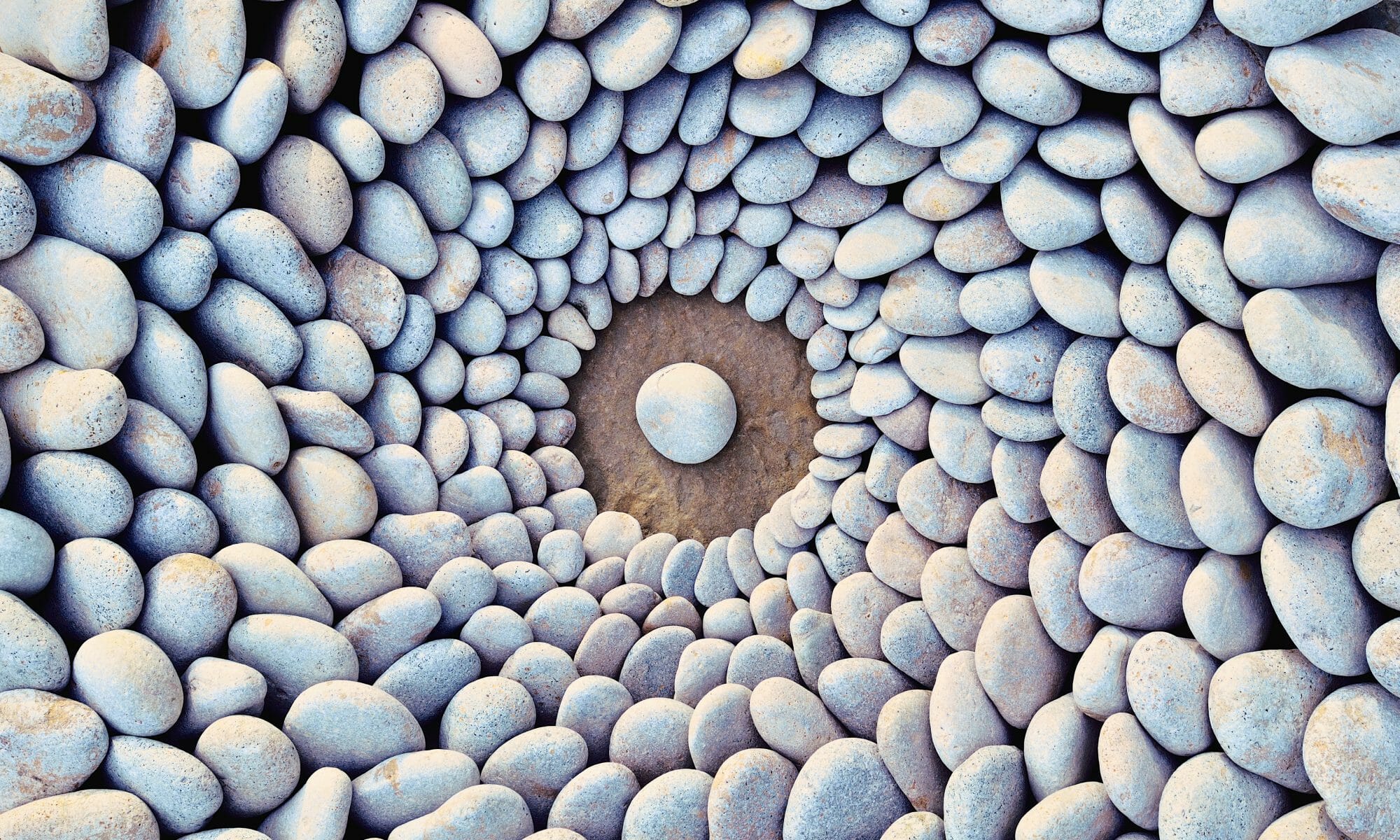 Sea stones laid out in the form of a circle to symbolize ketamine group therapy